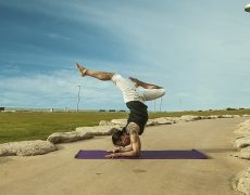 Eddy Toyonaga in Vrischikasana yoga pose in Tel Aviv