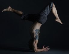 Eddy Toyonaga in an inverted yoga pose