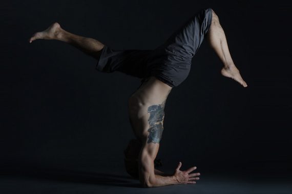 Eddy Toyonaga in an inverted yoga pose