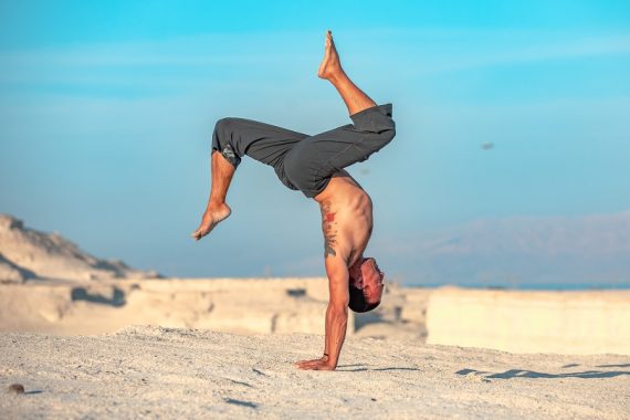 Eddy Toyonaga doing a handstand in the desert