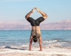 Eddy Toyonaga doing a handstand in the desert