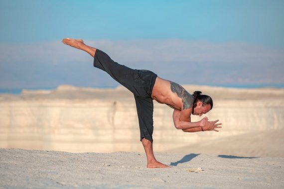 Eddy Toyonaga doing a yoga pose in the desert