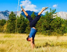 Eddy Toyonaga doing a handstand in the Rocky mountains